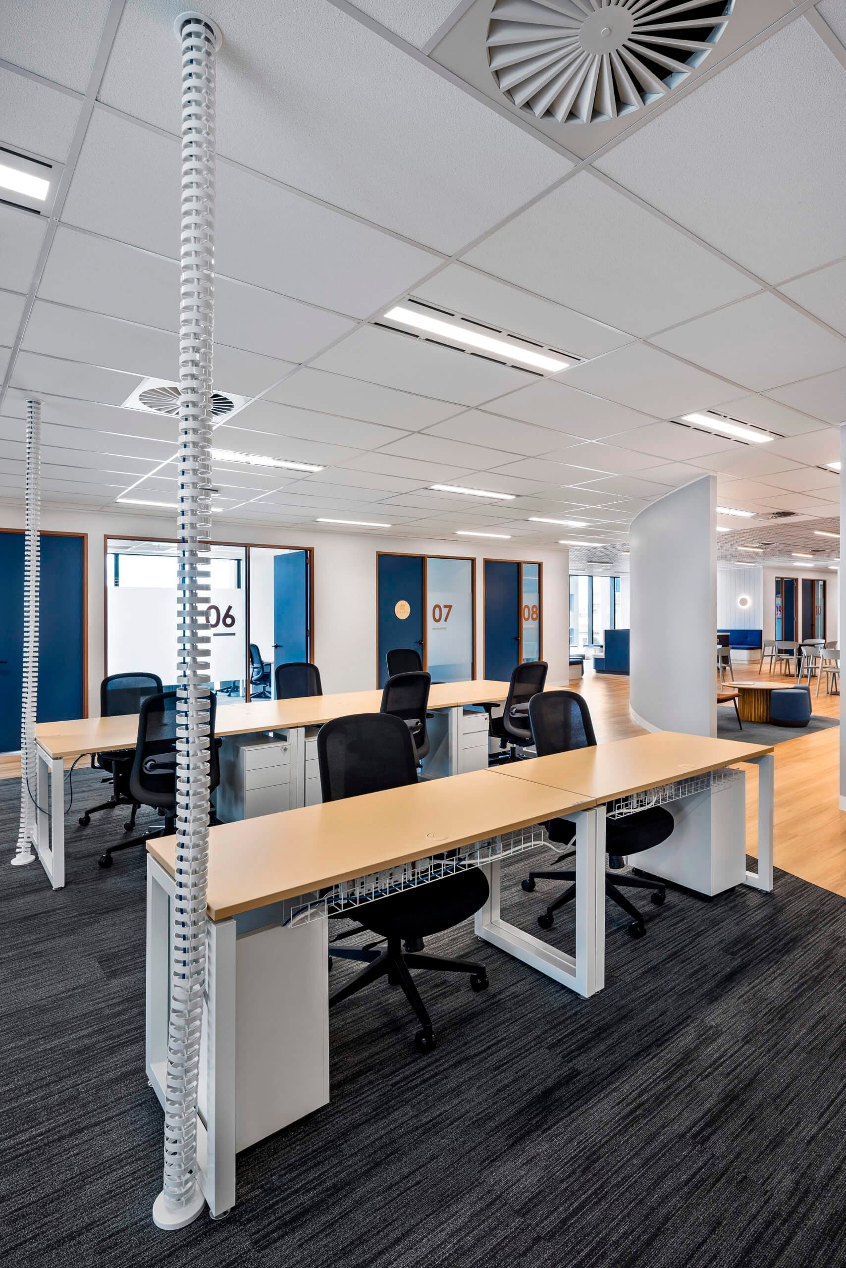 Shared desk spaces outside meeting rooms at 60 Moorabool Street, Geelong